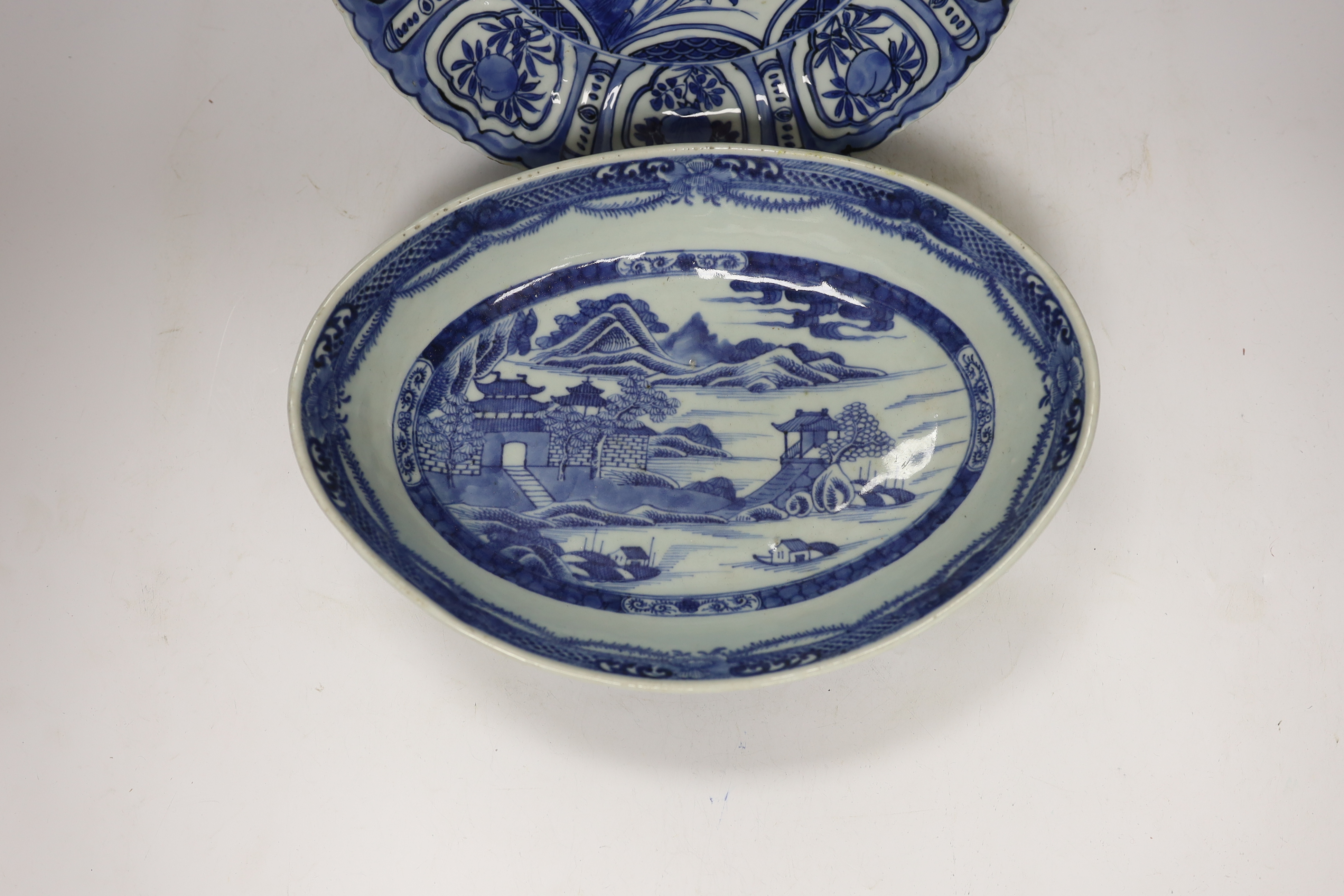 A Chinese Ming blue and white ‘praying mantis’ and butterfly dish, early 17th century, and a Chinese export oval serving dish, c.1820, 29cm